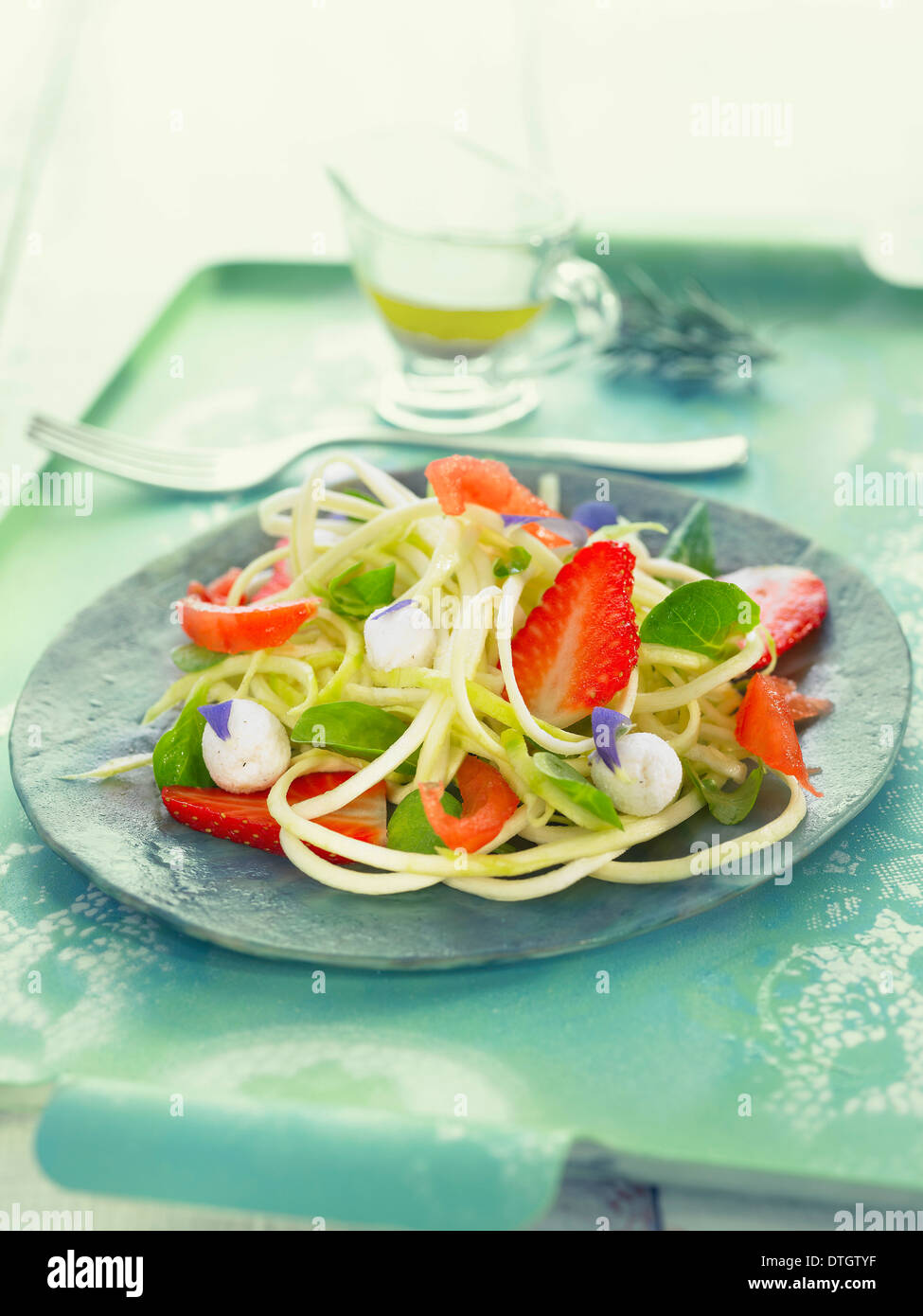 Asian noodle,baby spinach,strawberry ,mozzarella and tomato salad Stock Photo