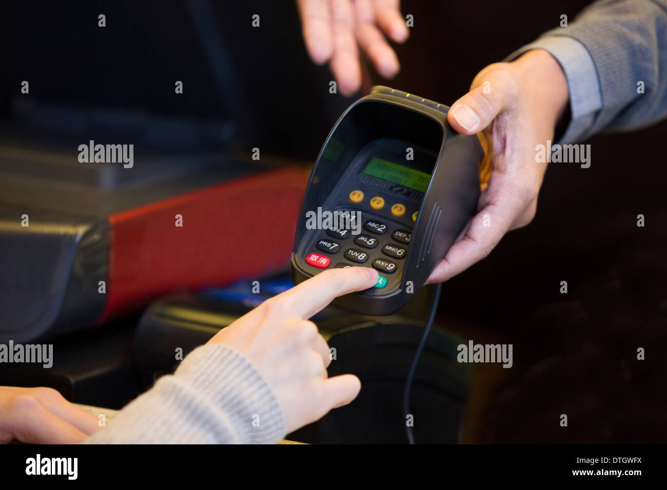 Customer entering credit card password Stock Photo Alamy