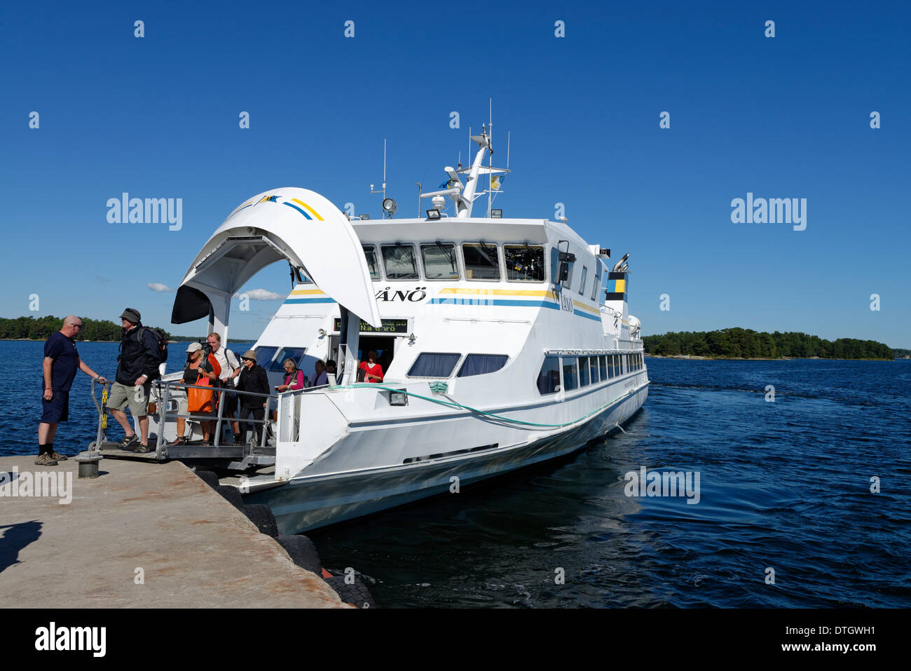 Jetty with the ferry from Waxholmsbolaget, Finnhamn Island in the central Stockholm archipelago, Stockholm, Sweden Stock Photo