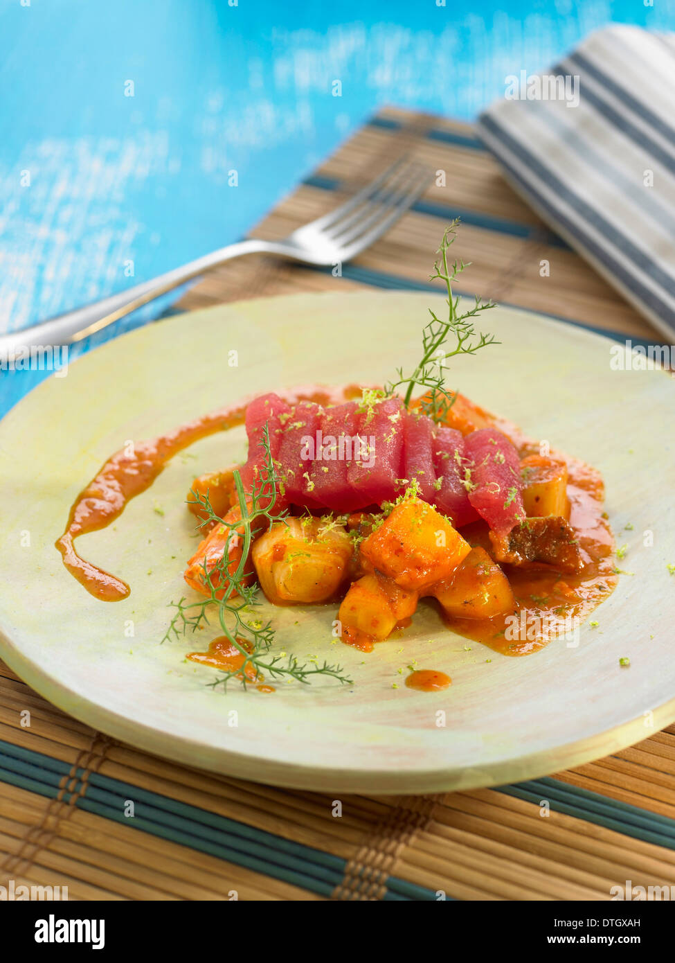 Potato Marmitako and tuna Sashimi in tomato sauce Stock Photo