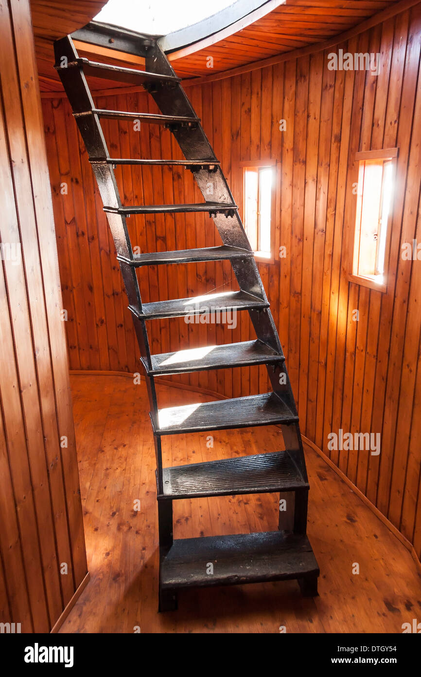 Black metal turning stair in wooden room Stock Photo Alamy