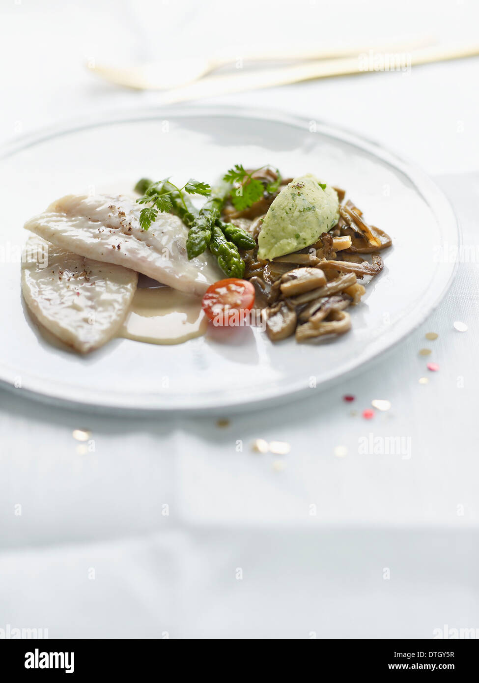 Squid with white butter sauce,mushroom and green asparagus stir-fry Stock Photo