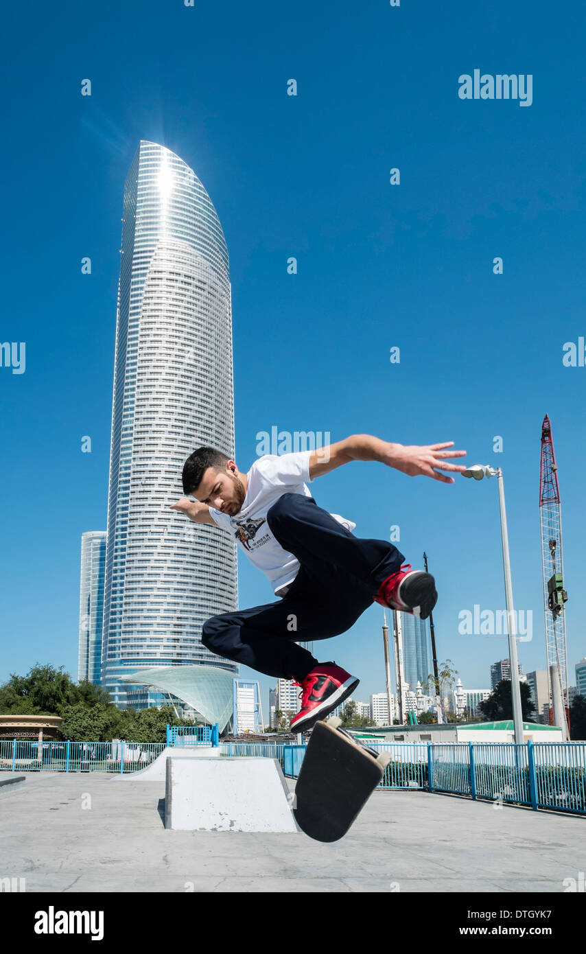 Man skateboarding in skatepark on Corniche in Abu Dhabi United Arab