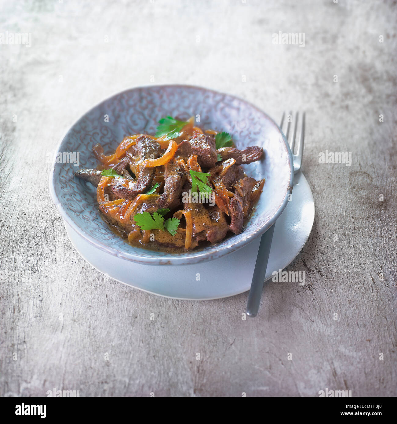 Sauteed beef with onions Stock Photo Alamy