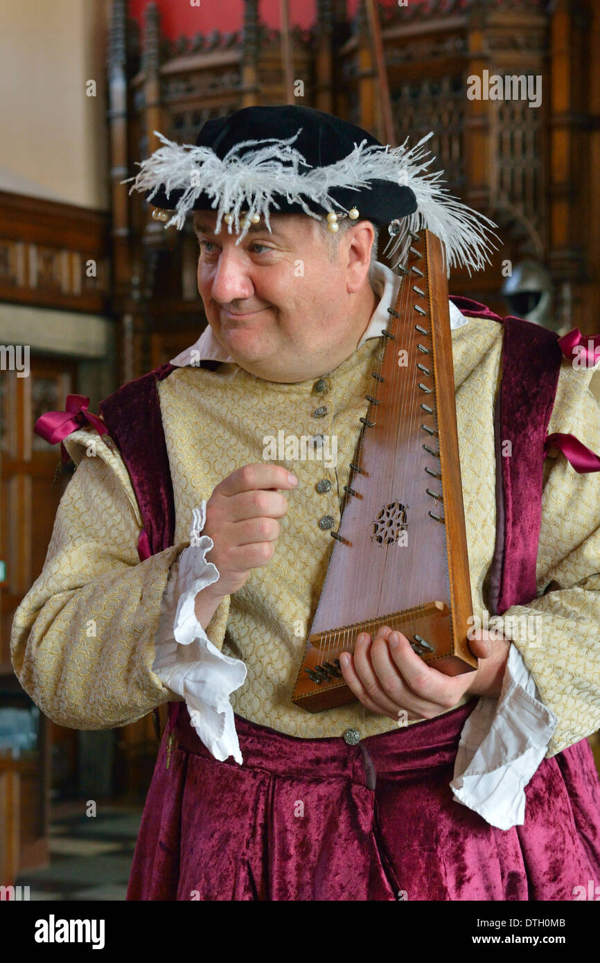 Musician in period costume performing on a medieval psaltery, Edinburgh