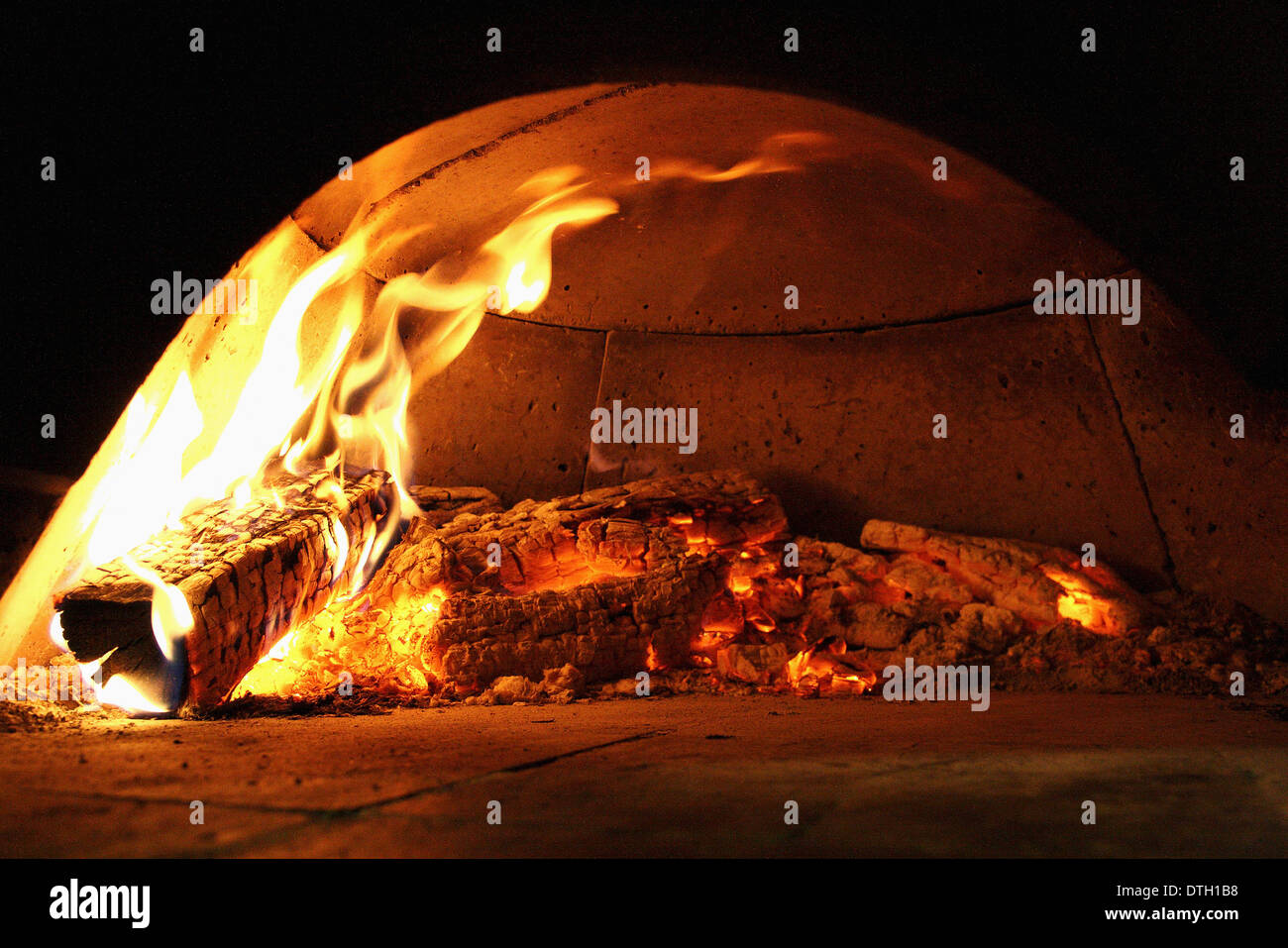 Bread baking in a traditional oven Stock Photo