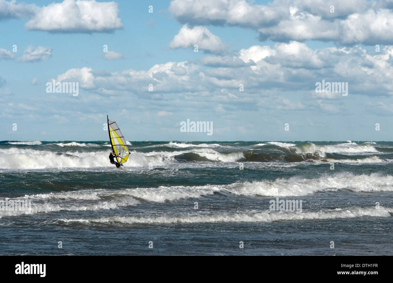 a windsurfer on wavy sea in Southern Italy Stock Photo