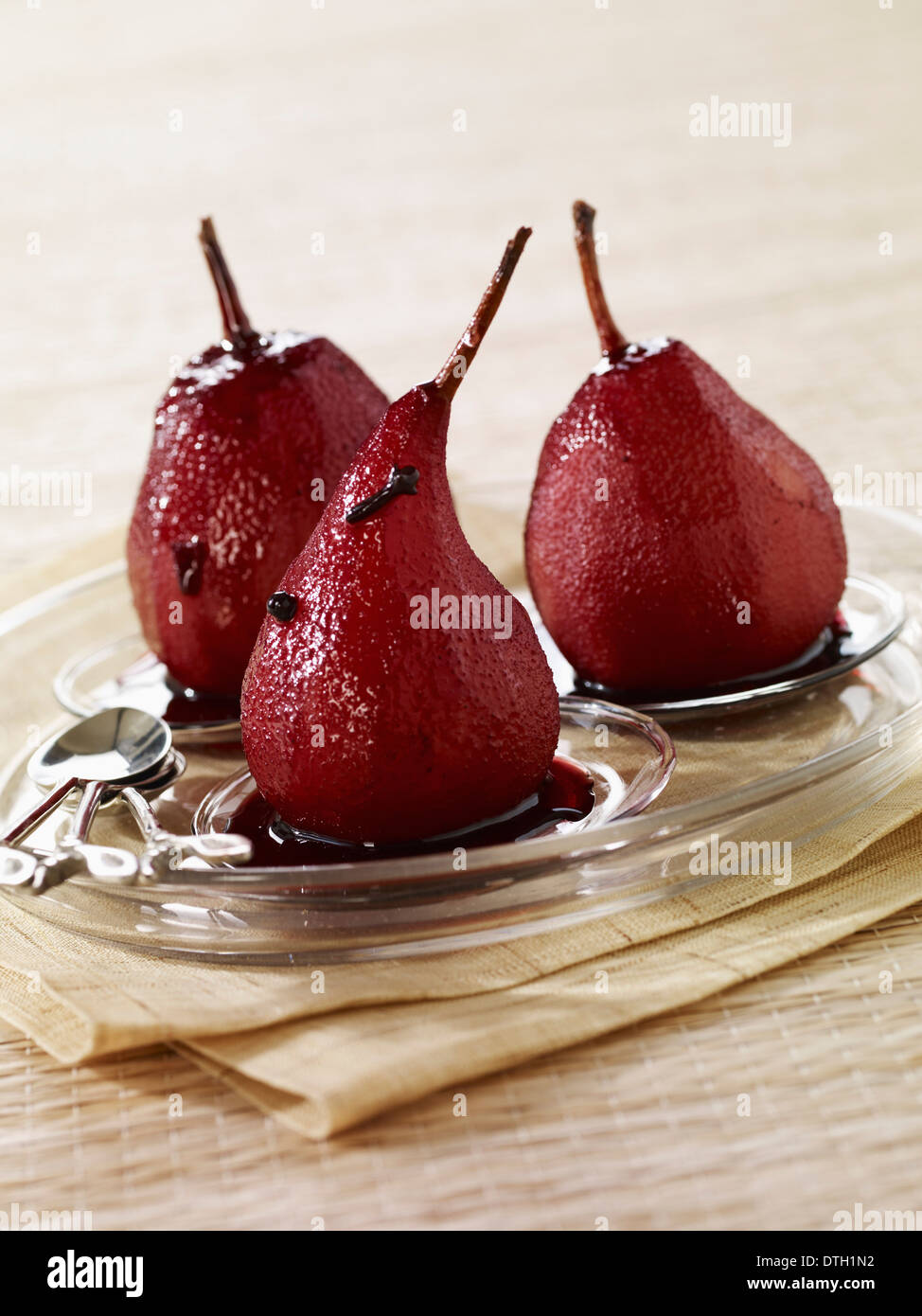 Pears poached in red wine with cloves Stock Photo
