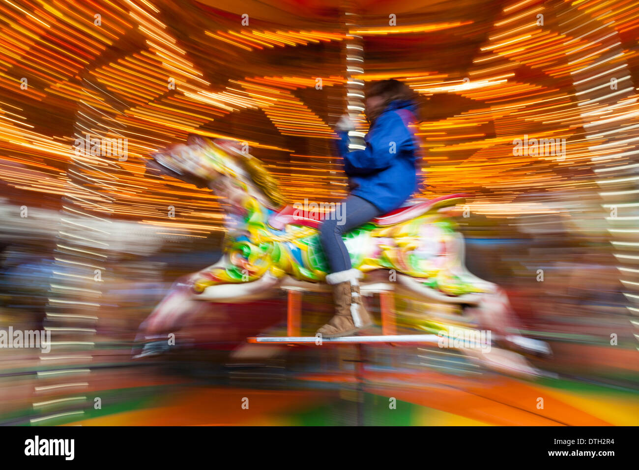 Carousel With Rider Riders become a blur as they ride on a merry-go-round (carousel Stock ...
