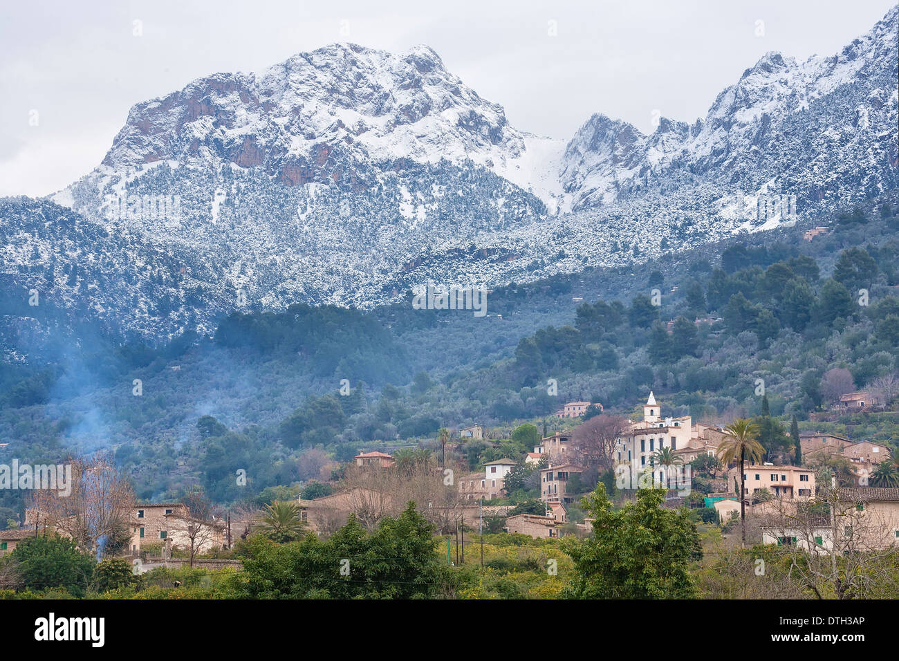 Biniaraix village and Puig Major, Tramuntana mountains, after a Winter snowfall. Sóller area. Majorca, Balearic islands, Spain Stock Photo