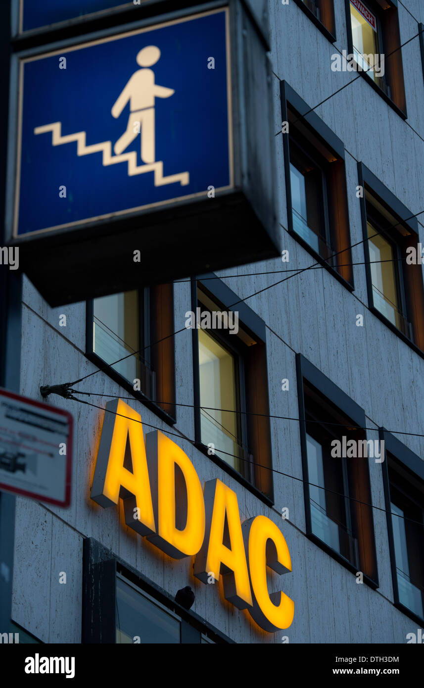 Munich, Germany. 17th Feb, 2014. A sign for an underpass is illuminated next to the logo of German automobile club ADAC (Allgemeiner Deutscher Automobil-Club e.V.) in Munich, Germany, 17 February 2014. Photo: Peter Kneffel/dpa/Alamy Live News Stock Photo