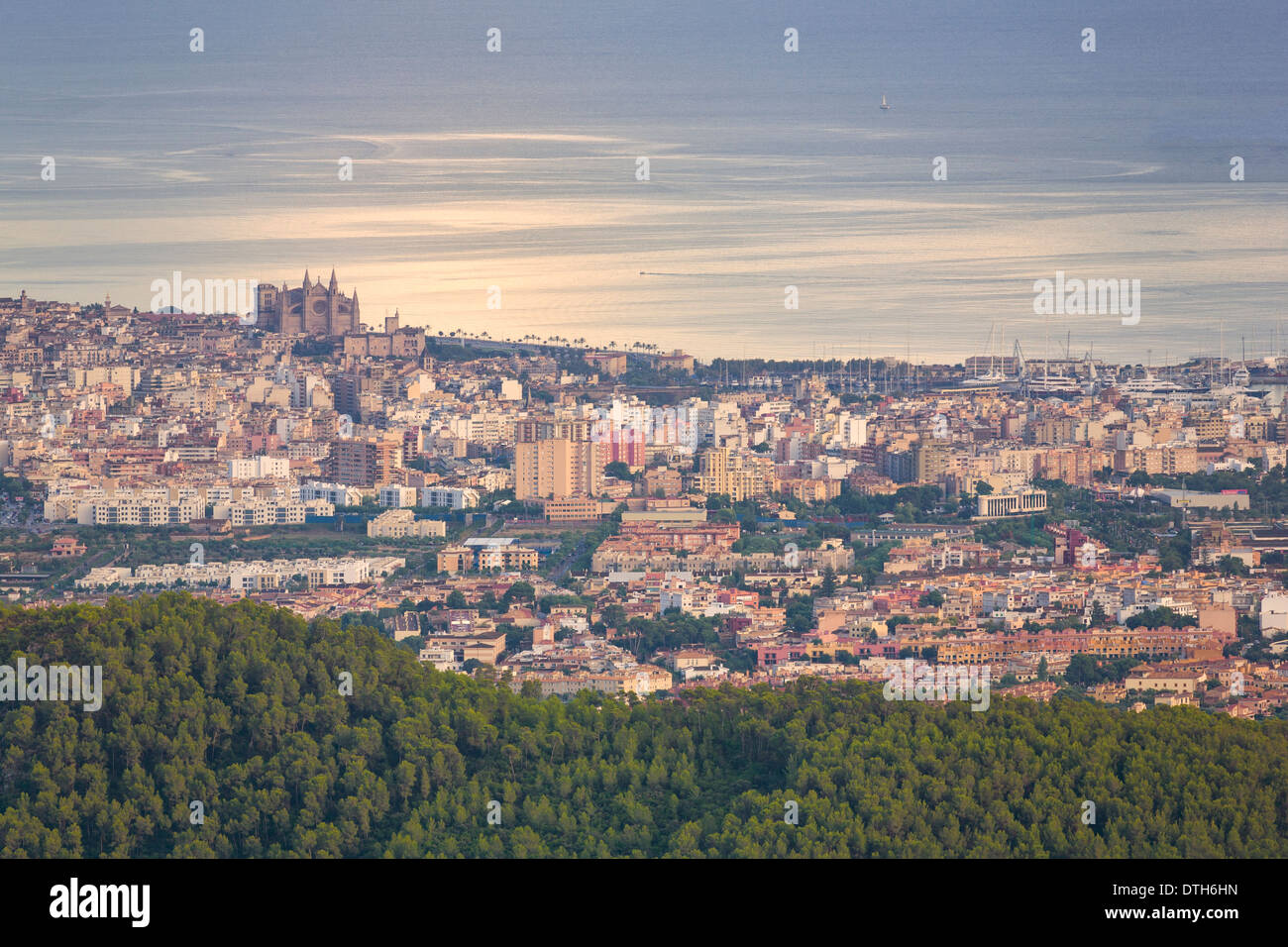 Partial view of Palma de Majorca town and harbour at sunset from a long distance. Majorca, Balearic islands, Spain Stock Photo