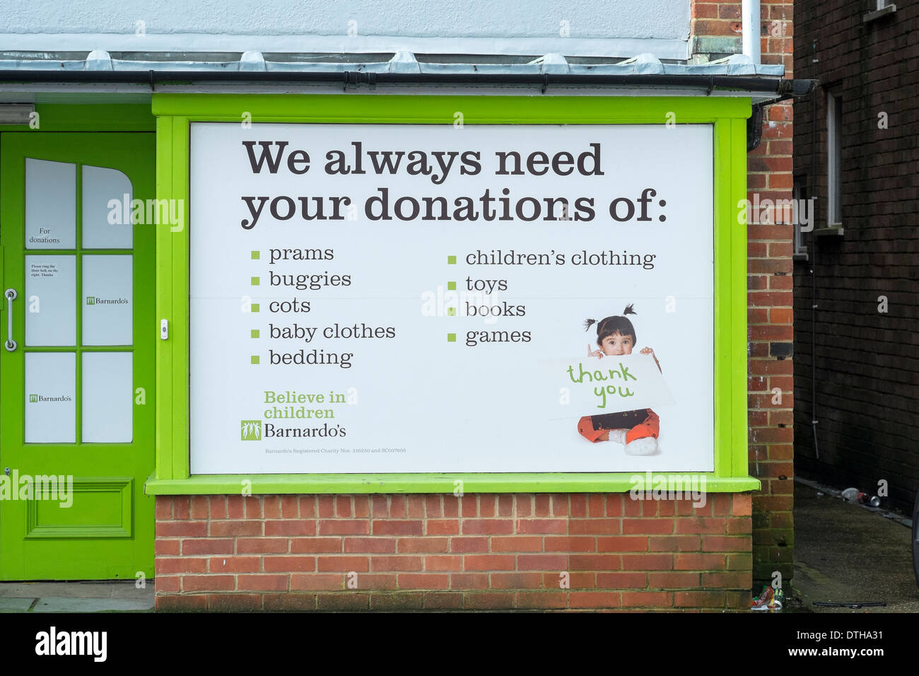 Rear of UK Barnardos children's charity store with large sign