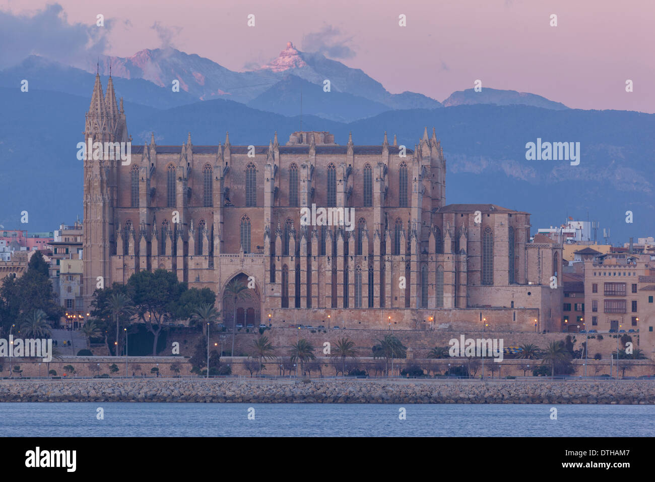 Palma de Majorca Gothic cathedral in Wintertime at dusk. South facade. Tramuntana mountains. Majorca, Balearic islands, Spain Stock Photo