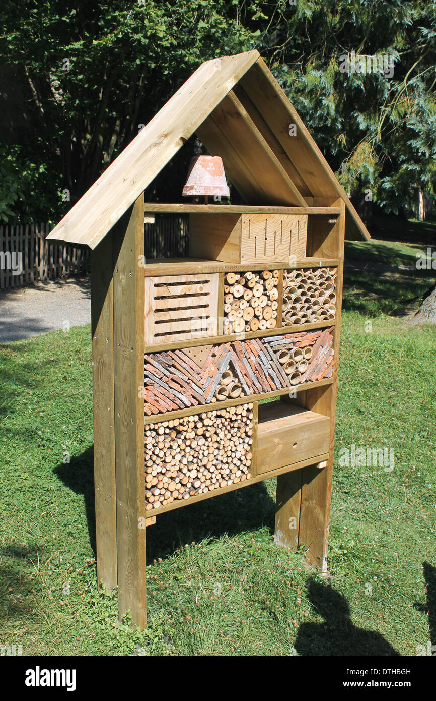 Example of an insect or bug hotel using recycled materials. Stock Photo