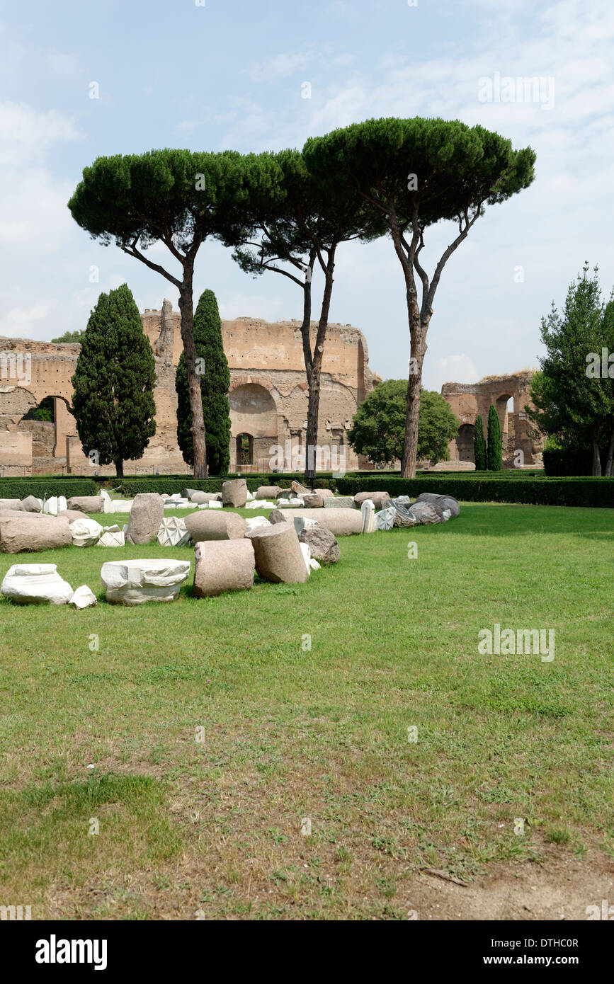 View over garden pine trees to ruins buildings along outer west wall Baths Caracalla Rome Italy Stock Photo