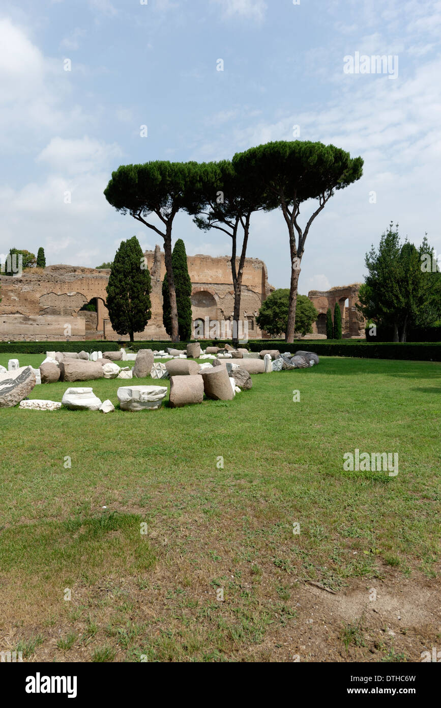 View over garden pine trees to ruins buildings along outer west wall Baths Caracalla Rome Italy Stock Photo