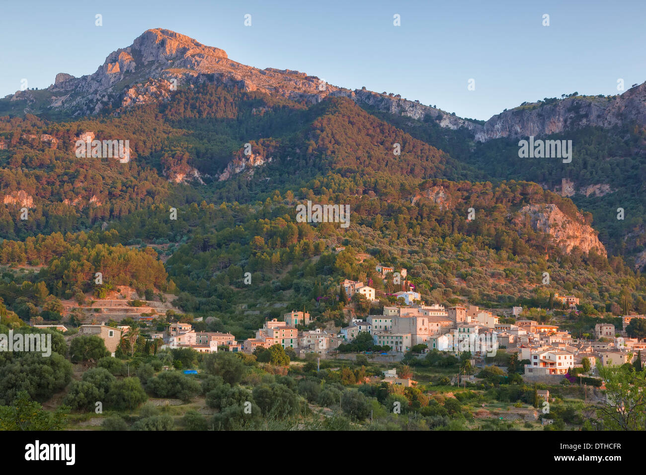 Estellencs village at the foot of Puig de Galatzó, Tramuntana mountains. Summer sunset. Balearic islands, Spain Stock Photo