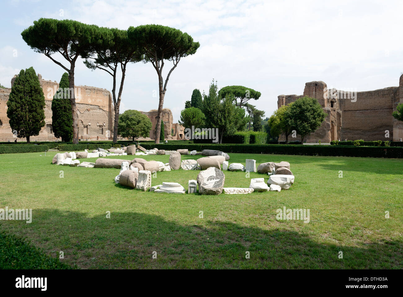 View over garden pine trees to ruins buildings along outer west wall Baths Caracalla Rome Italy Stock Photo