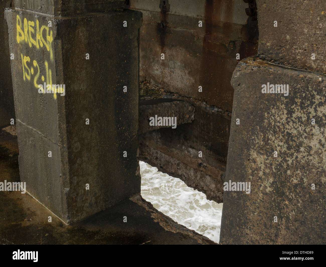 Newhaven, Sussex, UK. 18th February 2014. One of the breaches in the West arm shows what the power of the sea is capable of. Once breached the internal structure is rapidly eroded. The gap between pillars is about 6 ft. Credit:  David Burr/Alamy Live News Stock Photo