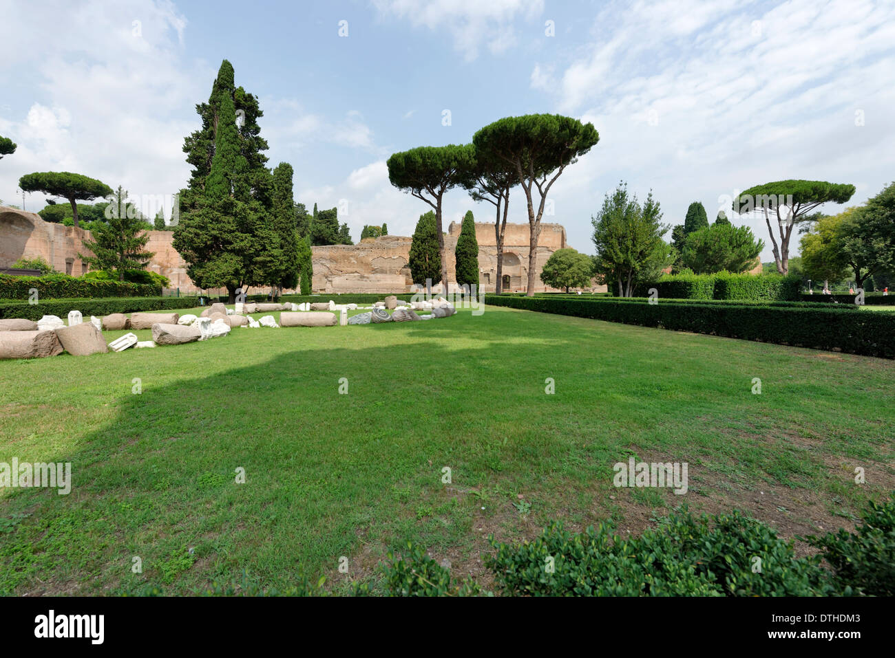 View over garden pine trees to ruins buildings along outer west wall Baths Caracalla Rome Italy Stock Photo