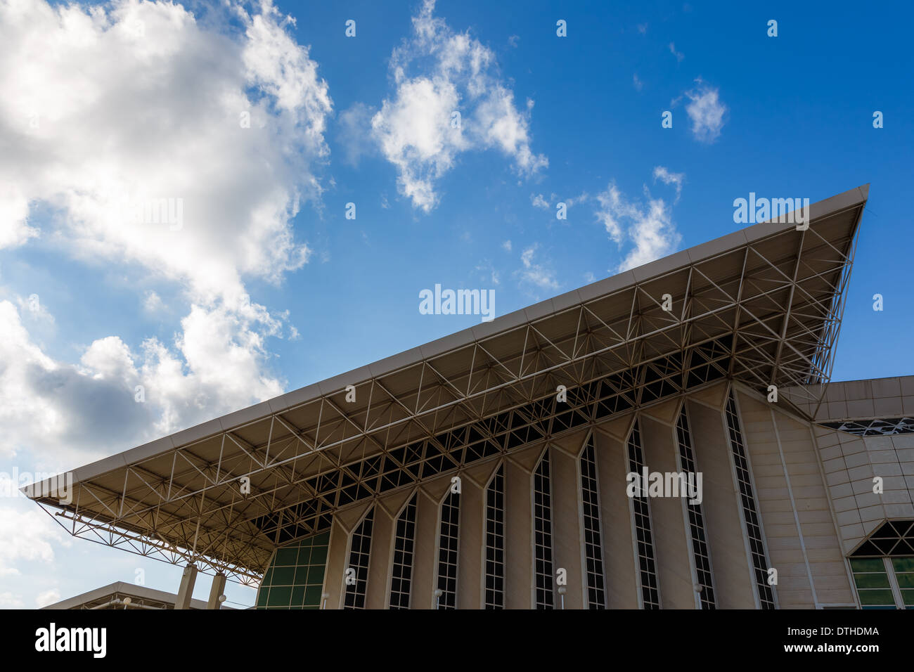 Abstract modern building detail background with sky and clouds Stock Photo