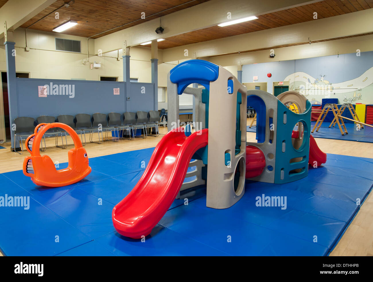 Slide and playground equipment indoors at a daycare centre Stock Photo