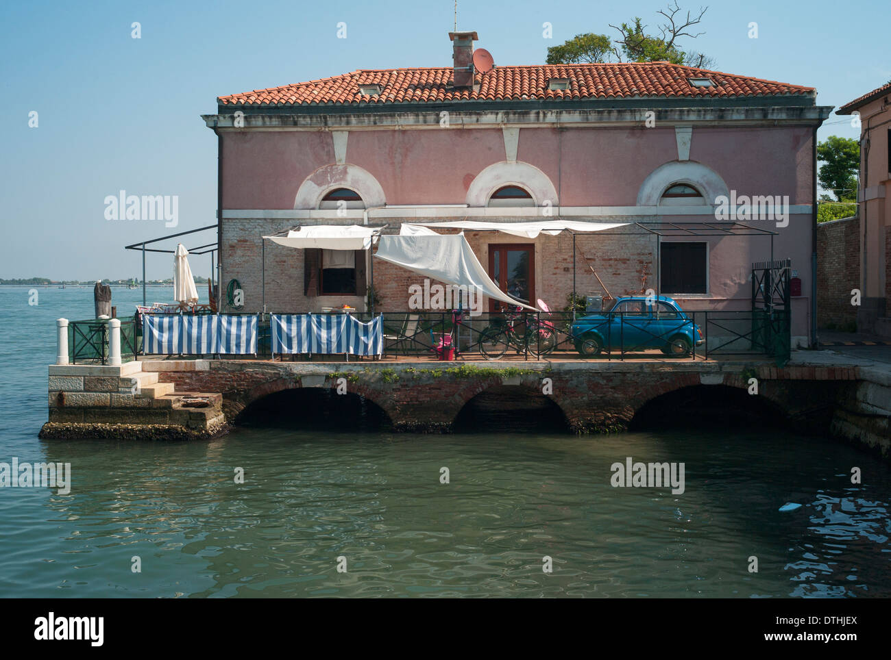 Typical local house and old Fiat 500 on Venice Lido Stock Photo