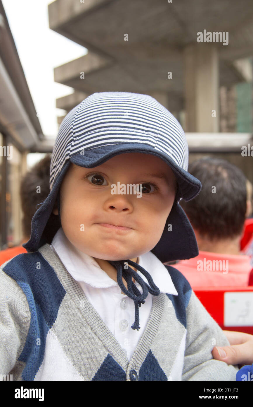 Little boy in cute cap on city tour bus Cologne Germany Stock Photo