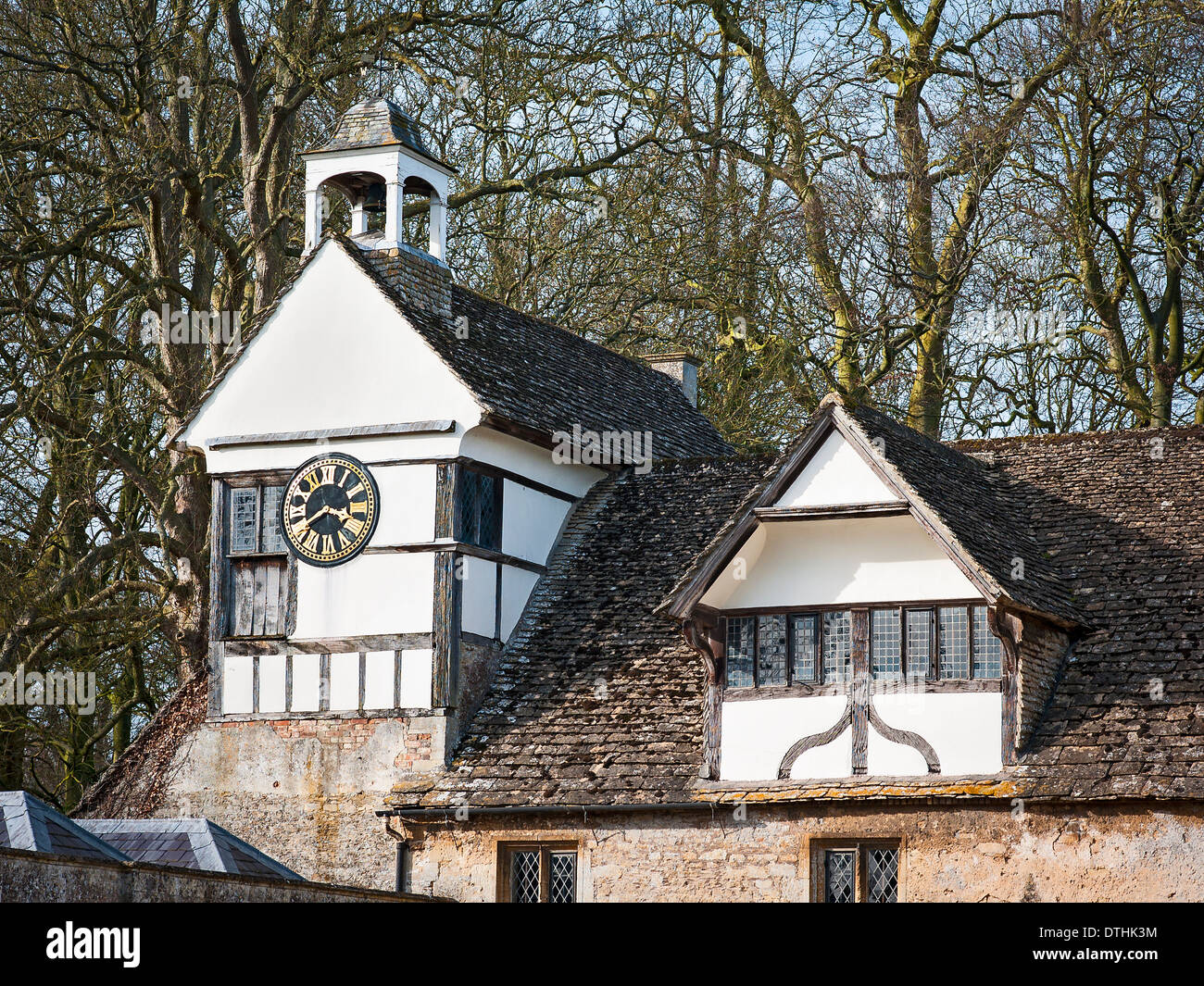 Clock tower and courtyard buildings at Lacock Abbey UK Stock Photo