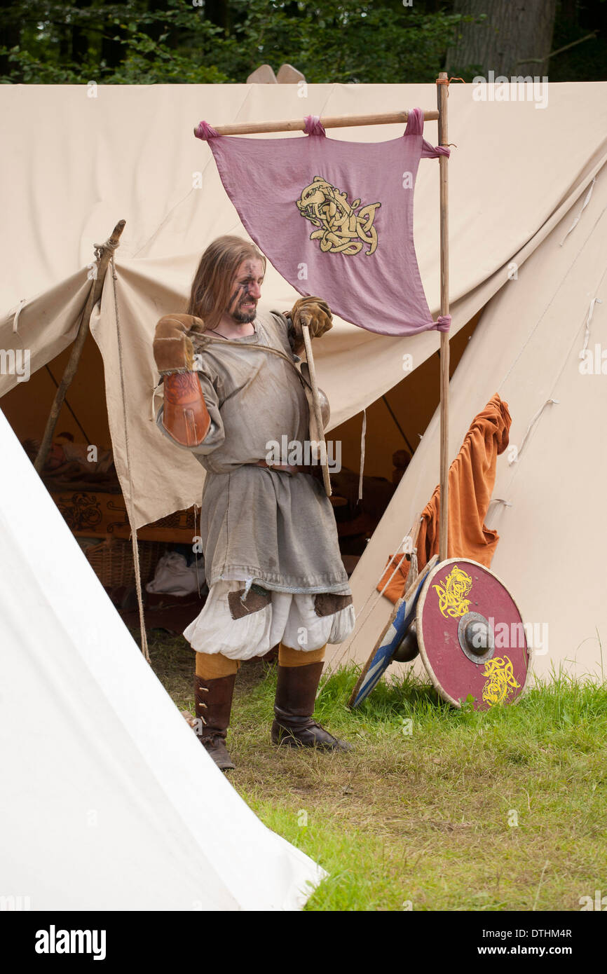 Viking warrior preparing for battle at a viking reenactment festival in Denmark Stock Photo