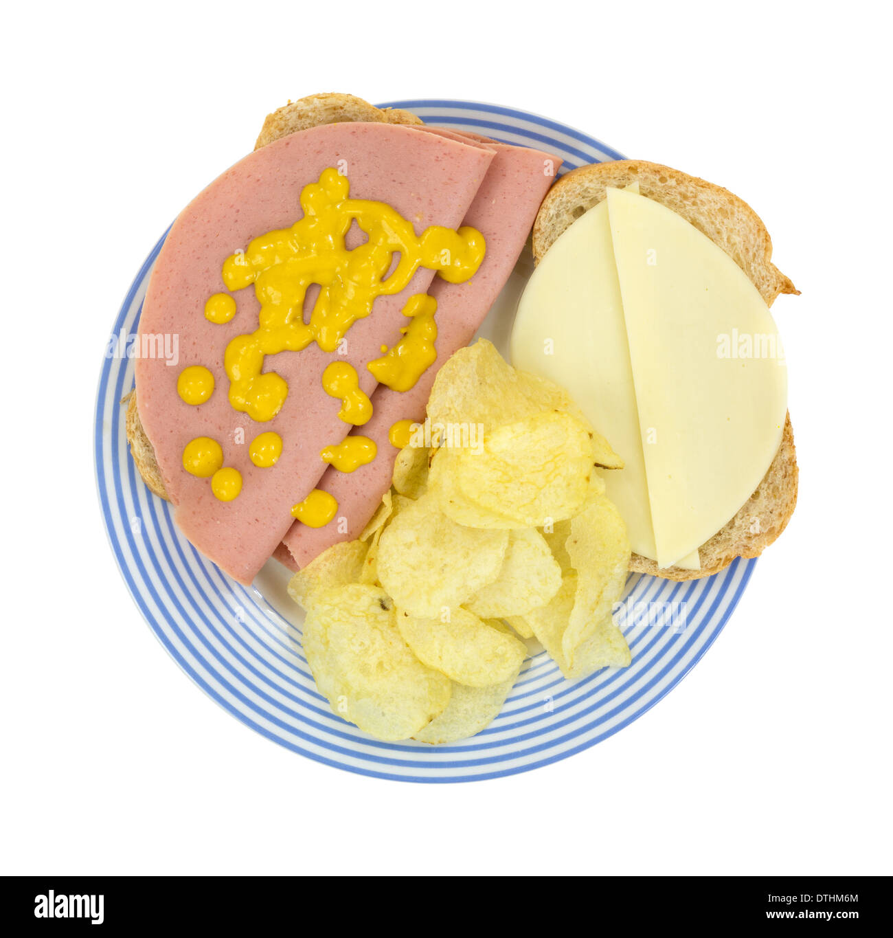 Top view of a baloney sandwich on Italian bread with provolone cheese