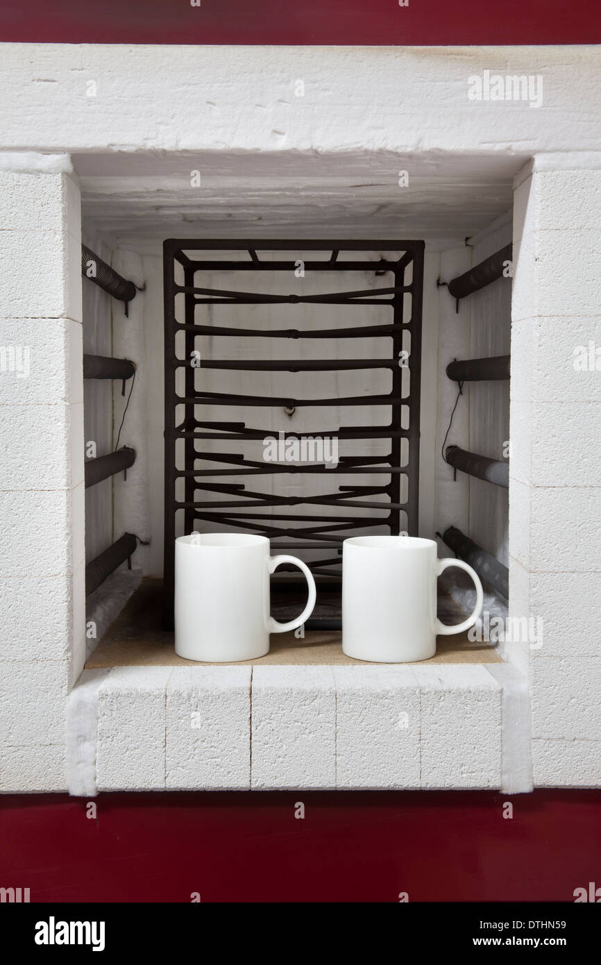 Pottery Kiln with two ceramic cup Stock Photo