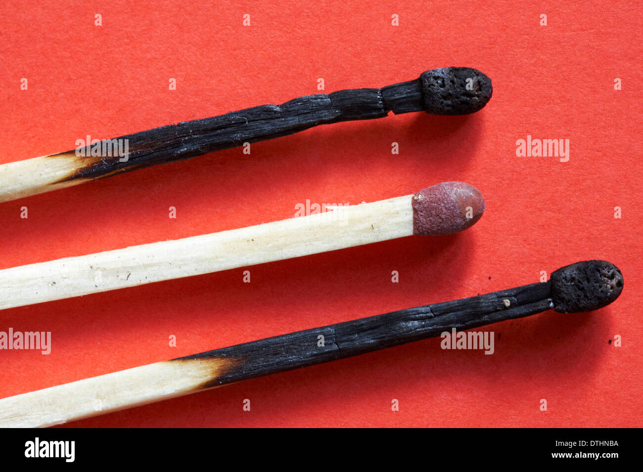 Bryant & May Extra Long Matches used matches set against red