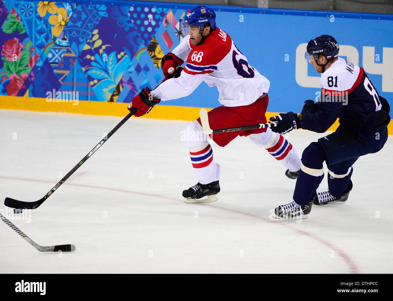 Jaromir Jagr of Czech Republic, left, and Marian Hossa of Slovakia pictured during the 2014 Winter Olympics men's ice hockey game Czech Republic vs Slovakia at Shayba Arena in Sochi, Russia, February 18, 2014. (CTK Photo/Roman Vondrous) Stock Photo