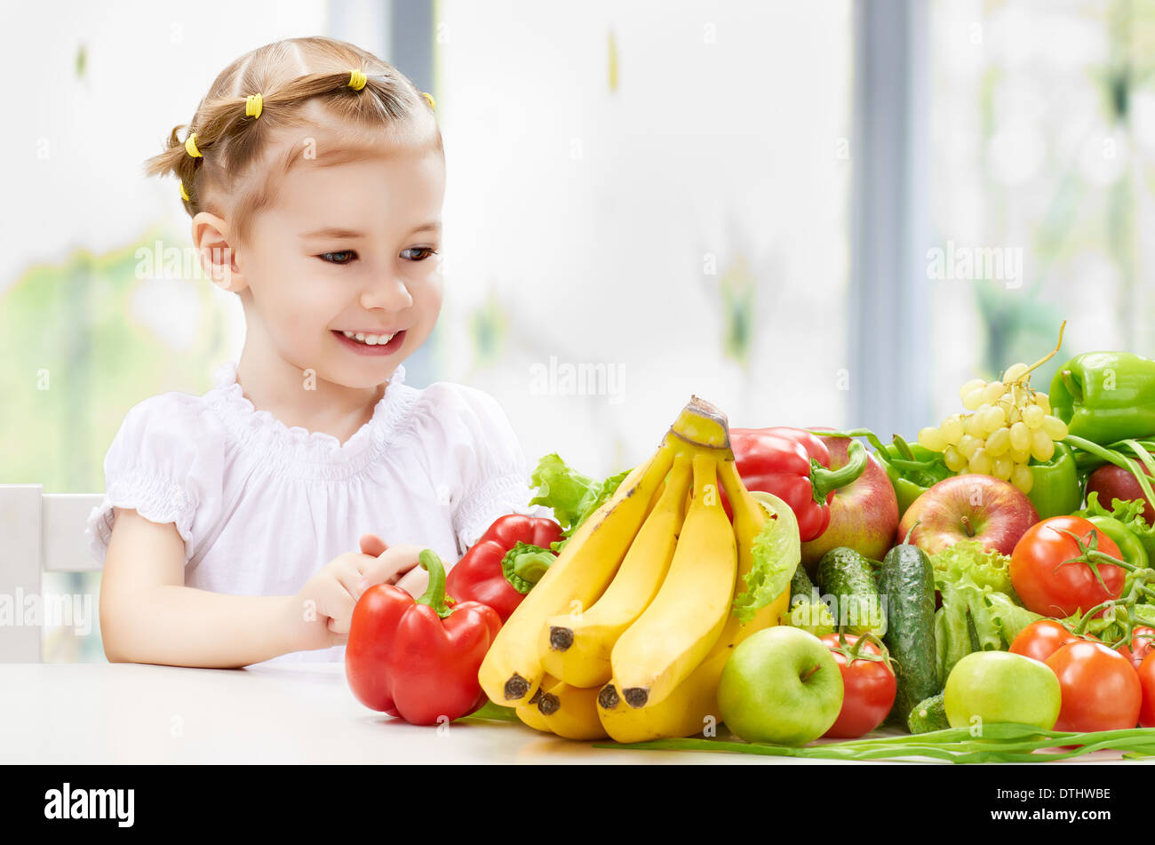 A beautiful girl eating fresh fruit Stock Photo Alamy