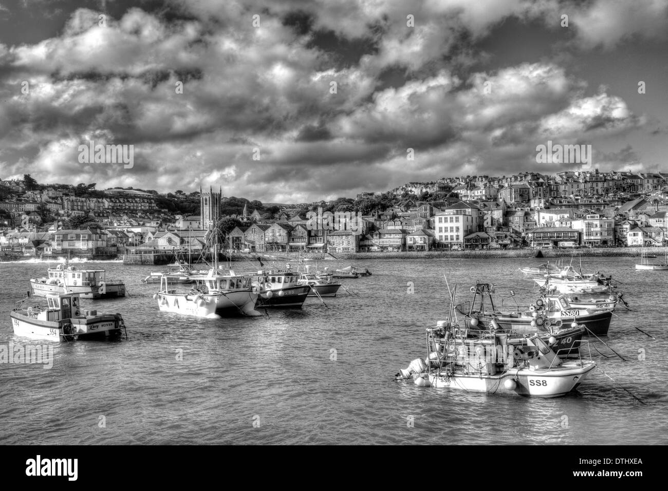 St Ives Cornwall England with harbour and boats a traditional Cornish fishing town in the UK in black and white Stock Photo