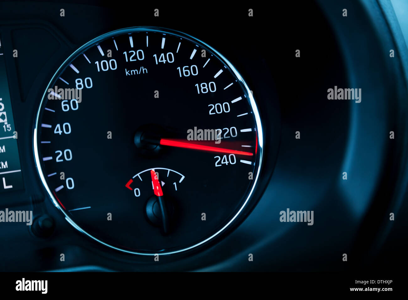 Close-up photo of modern automotive speedometer on black Stock Photo