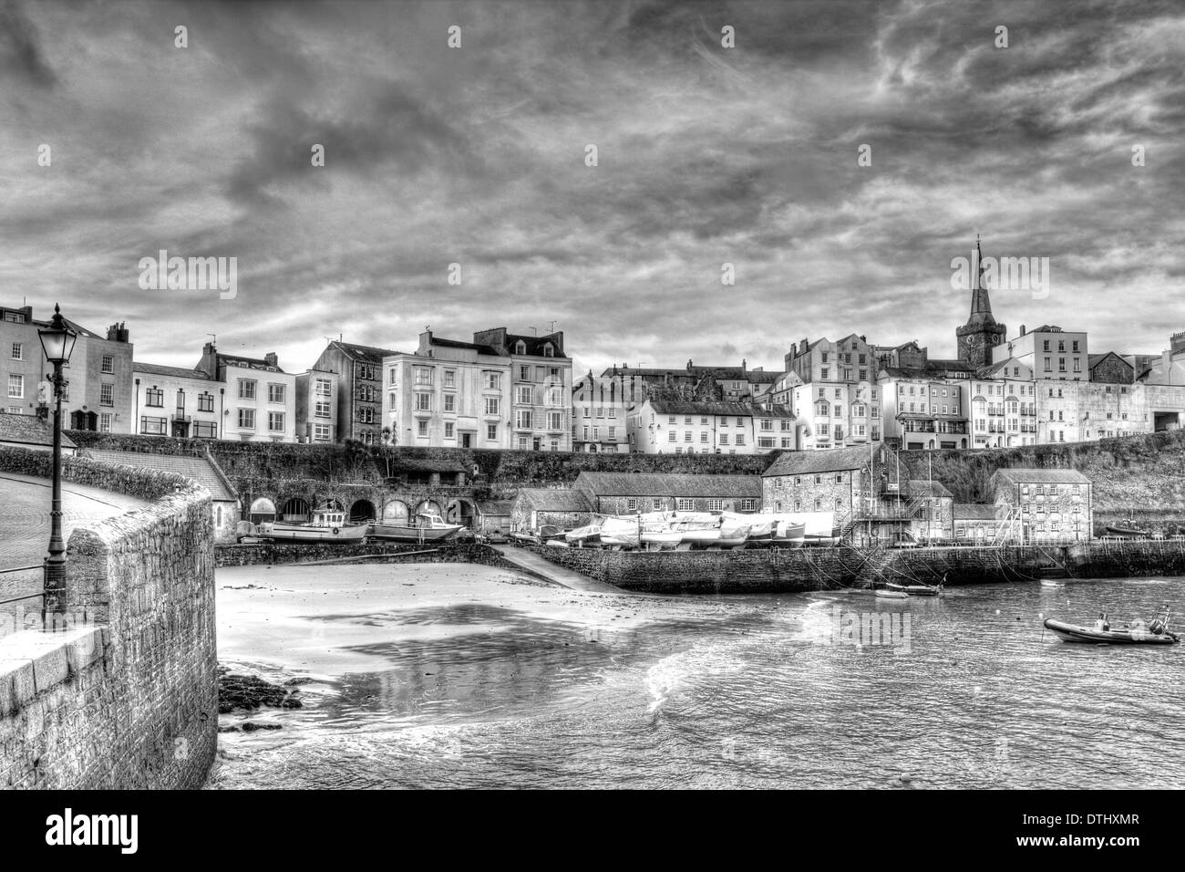View of Tenby town and harbour in Pembrokeshire Wales in black and white HDR historic Welsh town Stock Photo