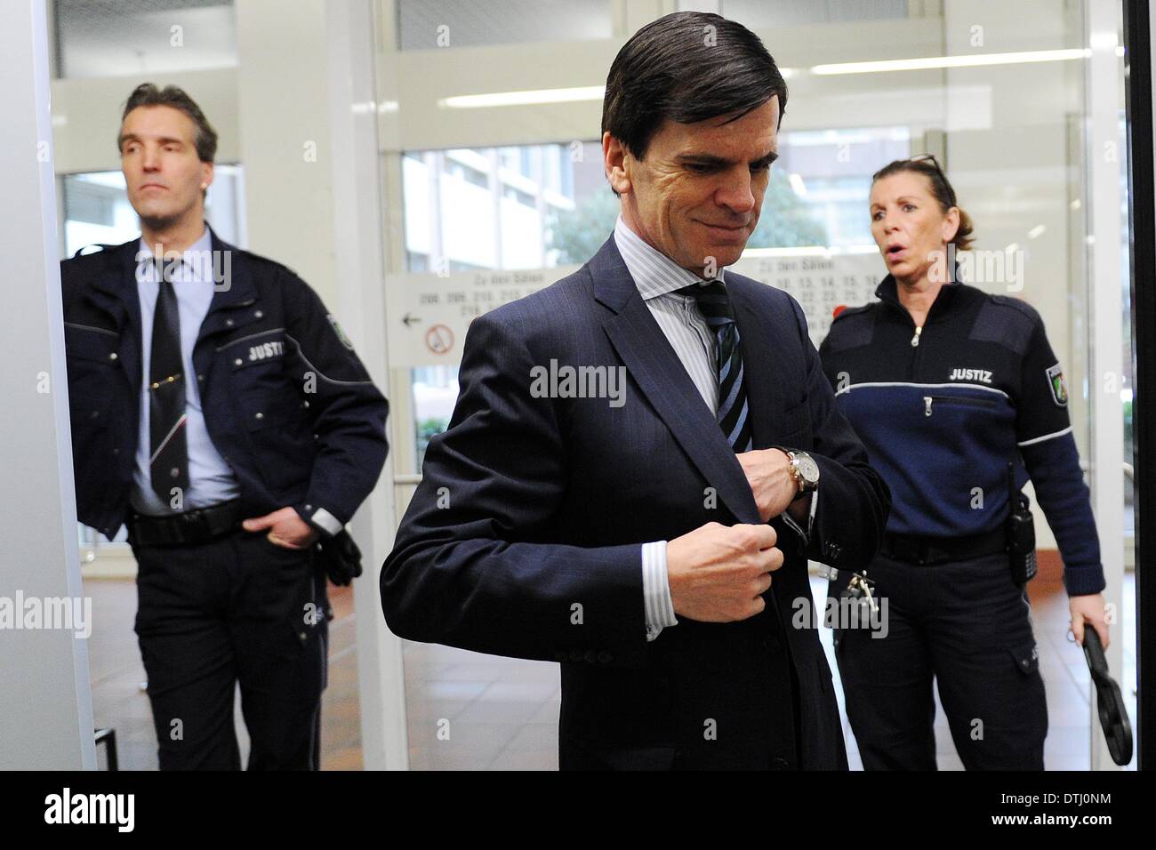 Cologne, Germany. 19th Feb, 2014. The head of investment bank Goldman Sachs in Germany, Alexander Dibelius (frot), arrives at the court room of the district court in Cologne, Germany, 19 February 2014. Dibelius is a witness in the Sal. Oppenheim trial. Photo: OLIVER BERG/dpa/Alamy Live News Stock Photo