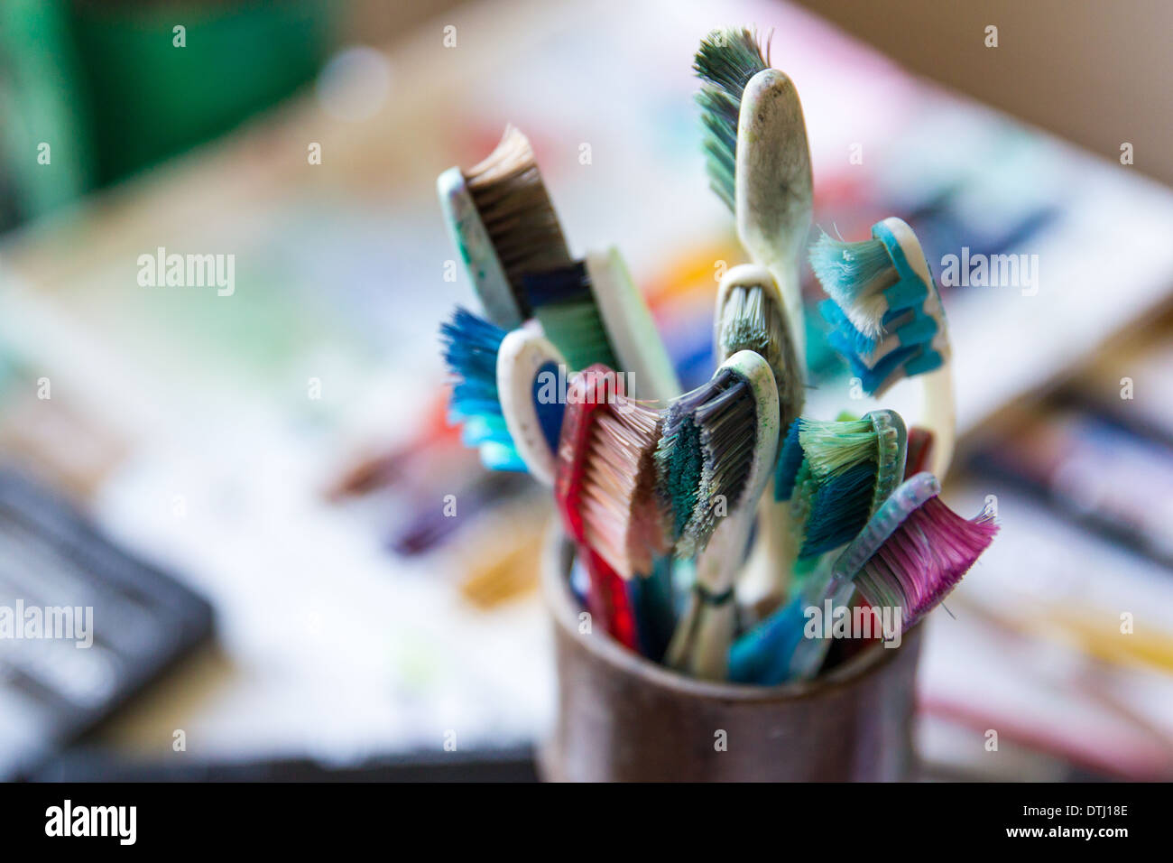 Toothbrushes used for painting Stock Photo