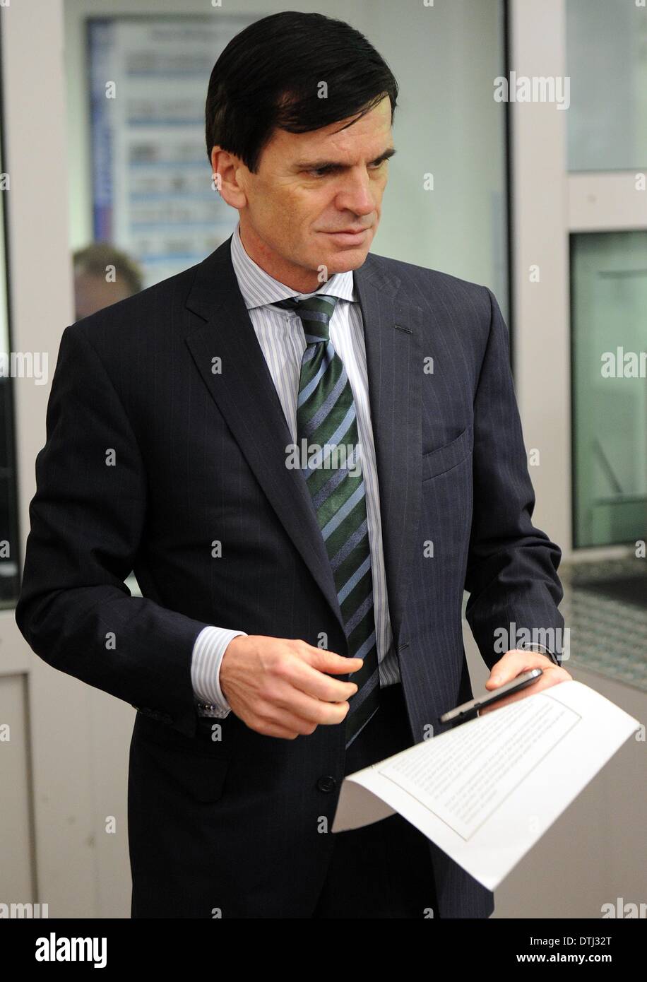 Cologne, Germany. 19th Feb, 2014. The head of investment bank Goldman Sachs in Germany, Alexander Dibelius, arrives at the court room of the district court in Cologne, Germany, 19 February 2014. Dibelius is a witness in the Sal. Oppenheim trial. Photo: OLIVER BERG/dpa/Alamy Live News Stock Photo