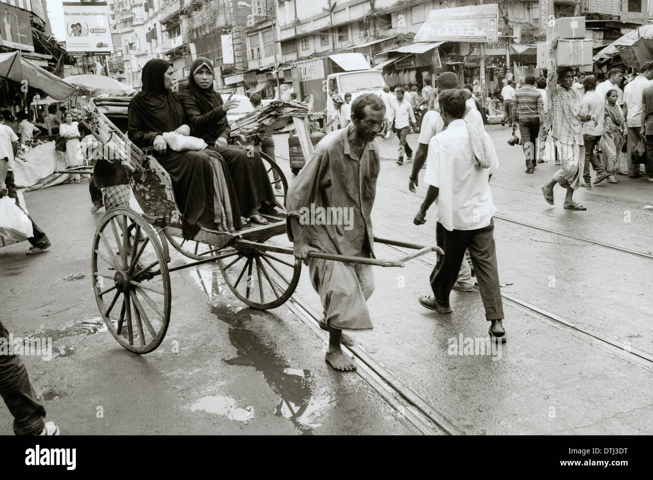 Pulled rickshaw in Kolkata Calcutta in West Bengal in India in South Asia. Reportage Photojournalism People Work Labour Life Lifestyle Transport Stock Photo