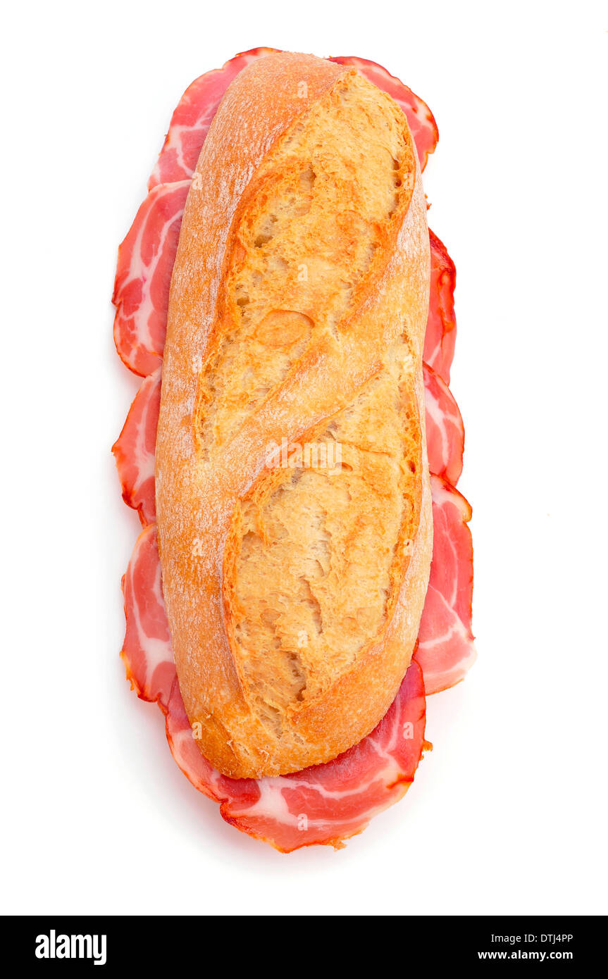 closeup of a spanish bocadillo de lomo embuchado, a sandwich with cold meats of pork, on a white background Stock Photo