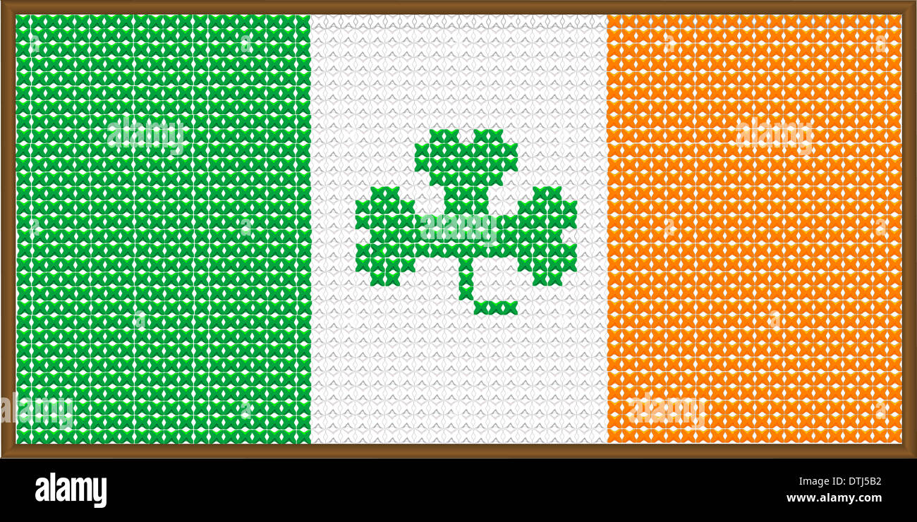 A cross stitch version of the flag of Ireland with a shamrock, with a frame.. Stock Photo