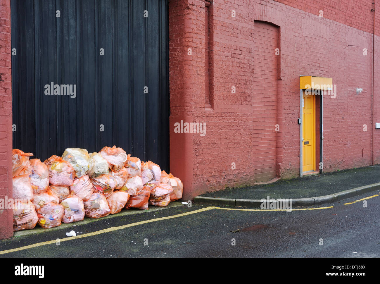 Rubbish stacked in doorway ready for collection for recycling Stock