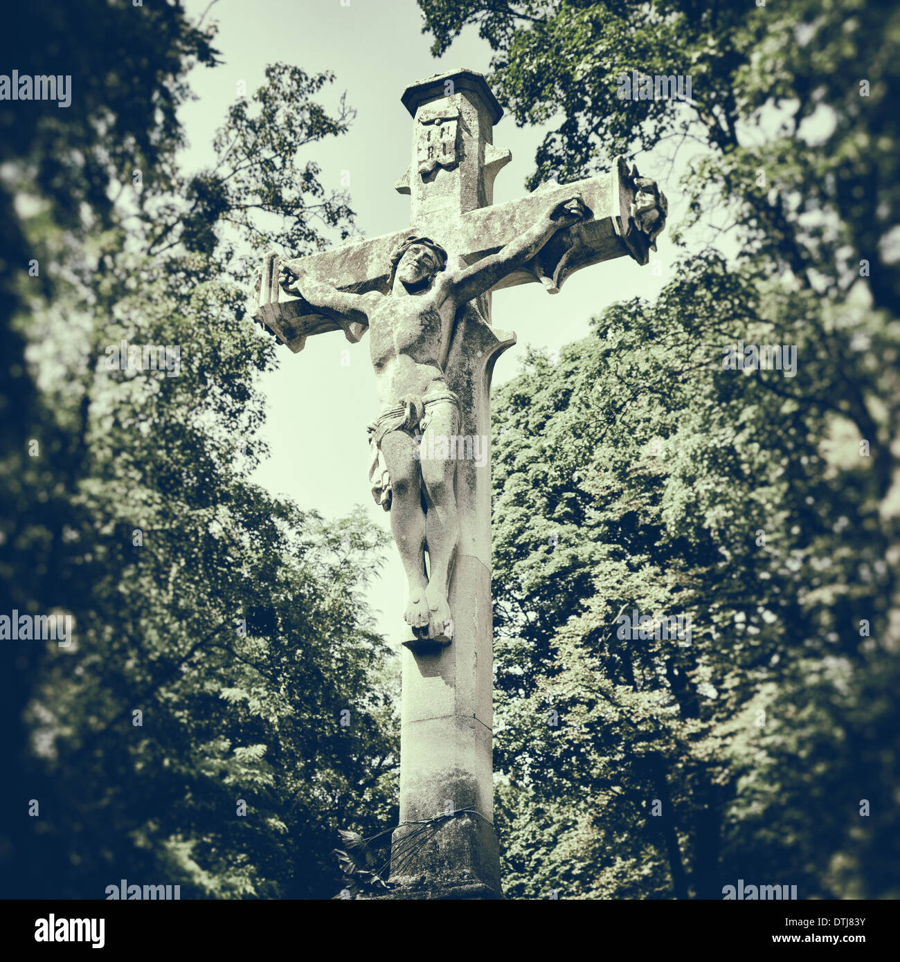 sculpture of Jesus on the cross, retro stylized photo Stock Photo