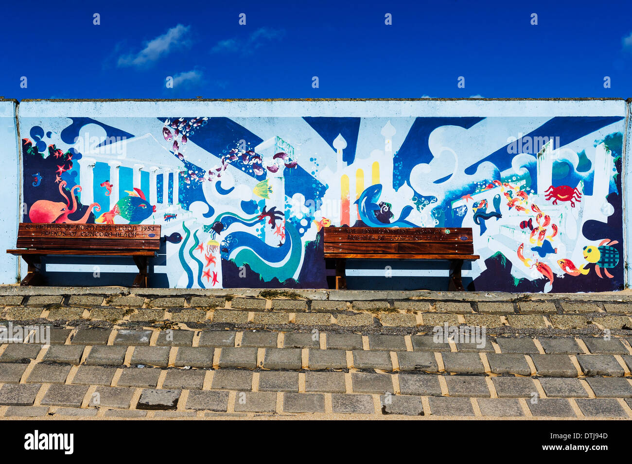 Canvey Island - A colourful mural painted on the sea wall flood defence at Canvey Island in Essex. Stock Photo