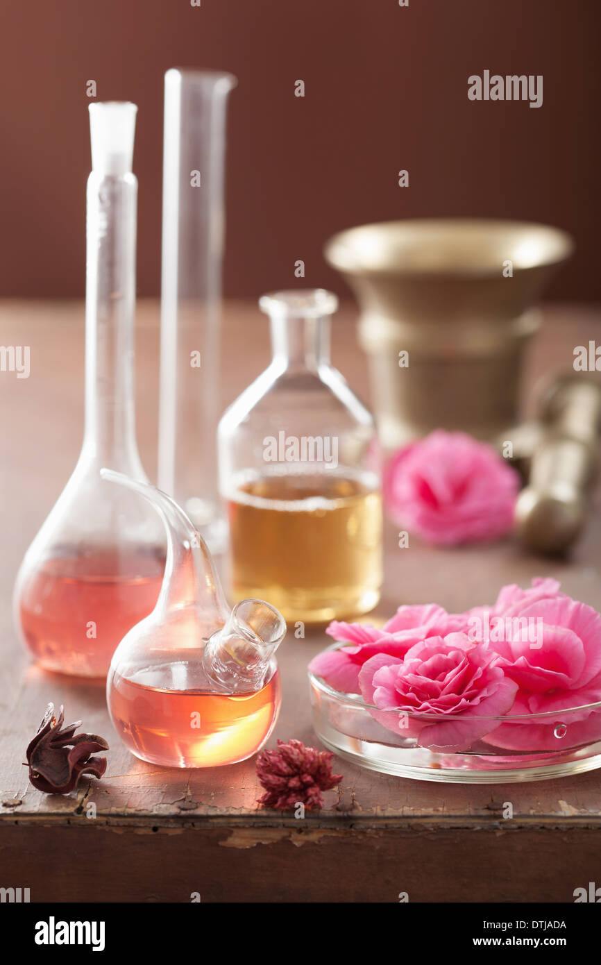 aromatherapy and alchemy with pink flowers Stock Photo