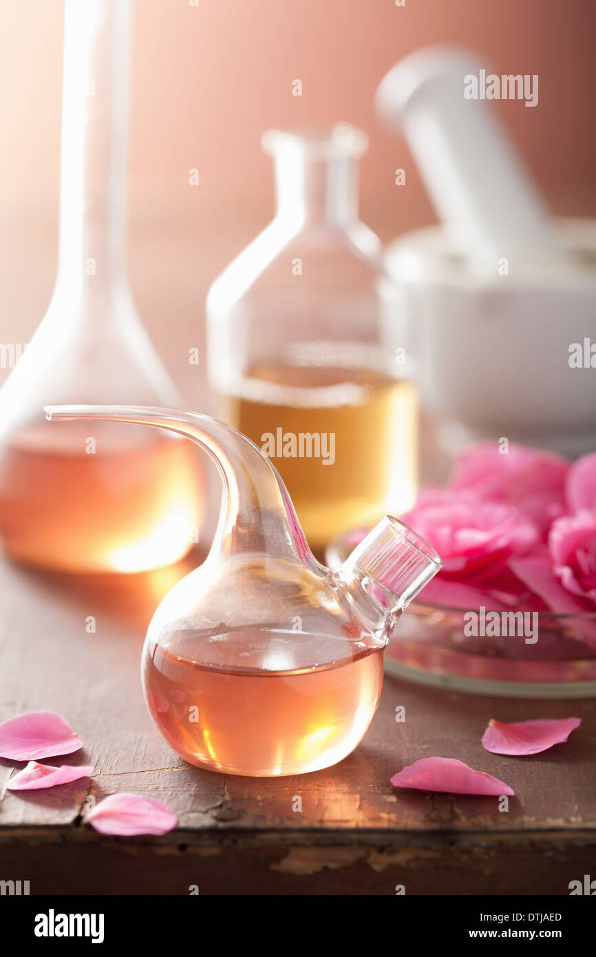 aromatherapy and alchemy with pink flowers Stock Photo